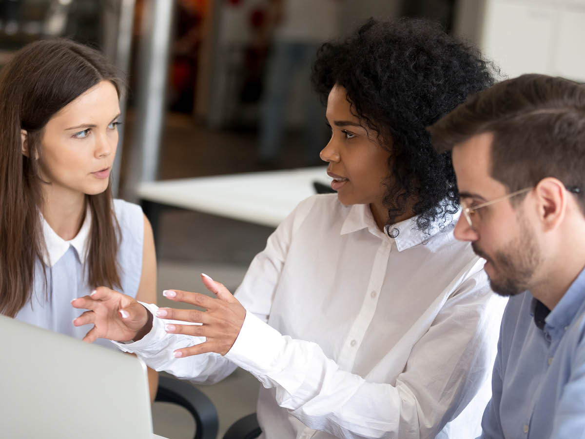 Diverse employees having a discussion